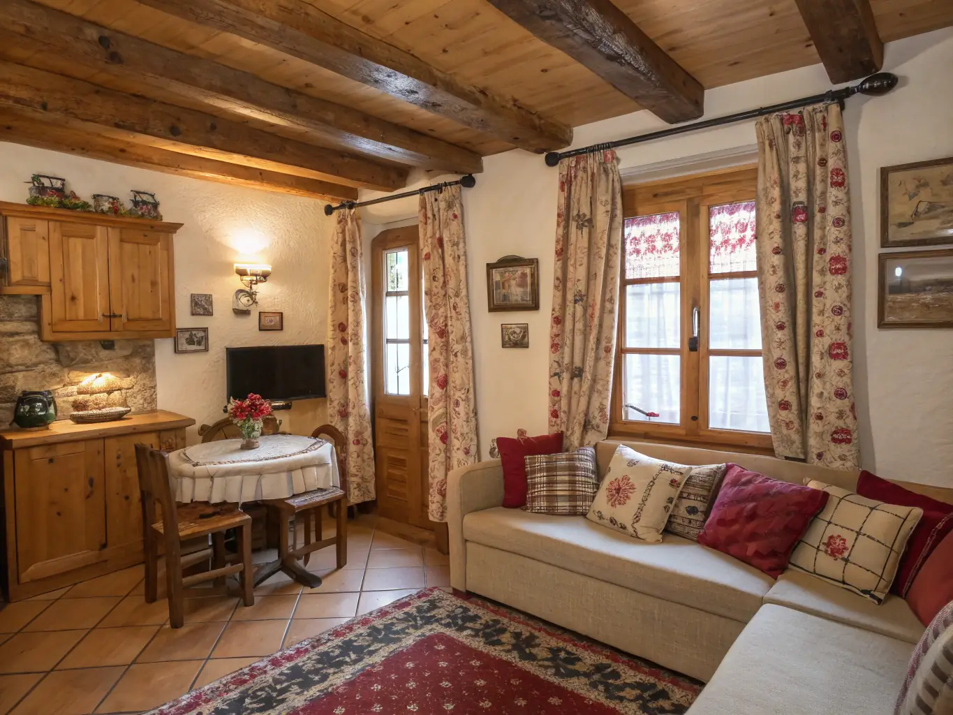 A bright and airy living room in one of the Maison d'Alsace apartments, featuring traditional Alsatian decor, comfortable seating, and large windows overlooking a garden.
